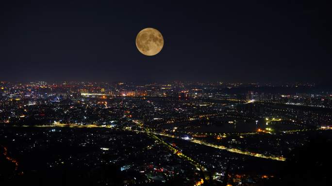 中秋节夜晚城市月亮升起延时城市夜景风光