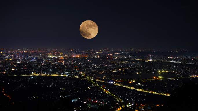 中秋节夜晚城市月亮升起延时城市夜景风光