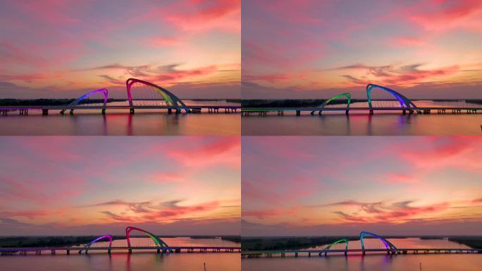 4k霞光中的江苏省淮安市白马湖大桥