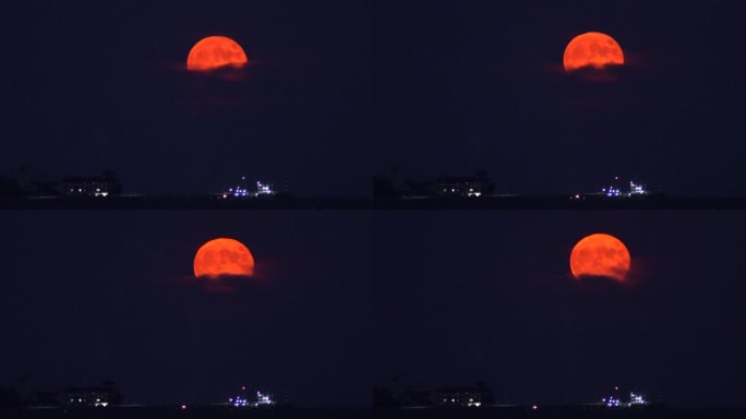 威海湾刘公岛铁码头上空的超级红月亮