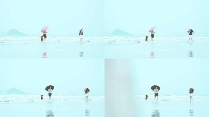 一家三口在海边游玩愉快的拍照-04