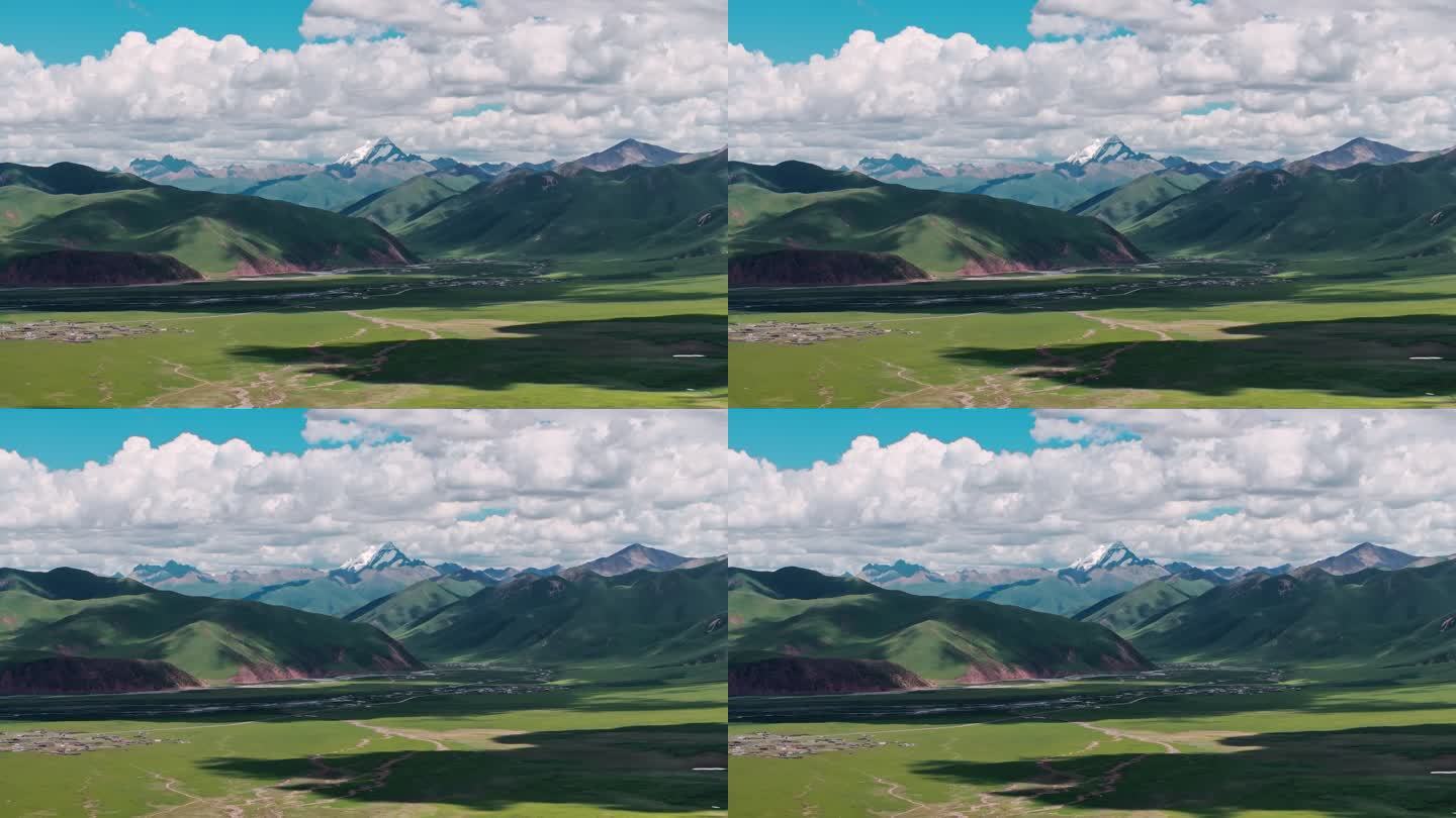 西藏那曲草原尽头的巍峨雪山大气航拍