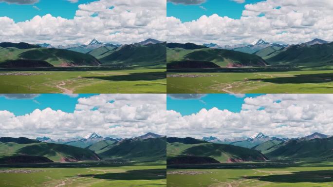 西藏那曲草原尽头的巍峨雪山大气航拍