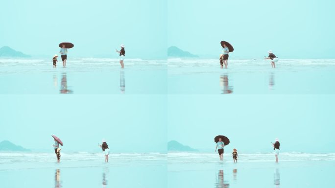 一家三口在海边游玩愉快的拍照-01