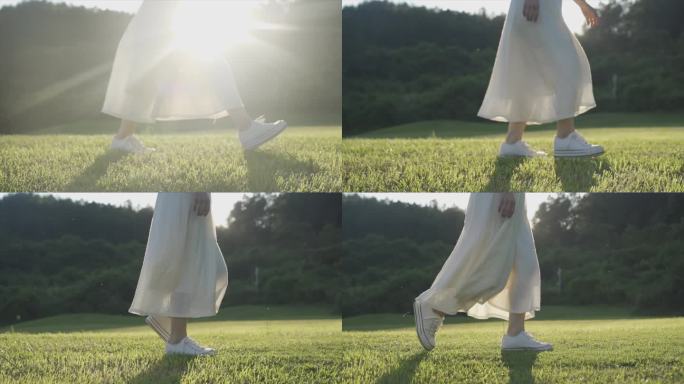 唯美白裙美女光脚走过草地脚步特写浪漫意境