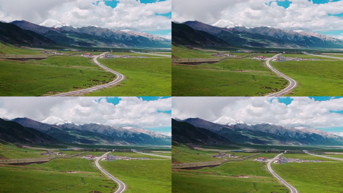 雪山草原上的青藏铁路行驶的列车大气航拍