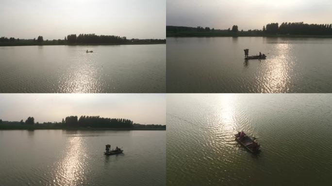 夕阳湖面渔船打渔航拍