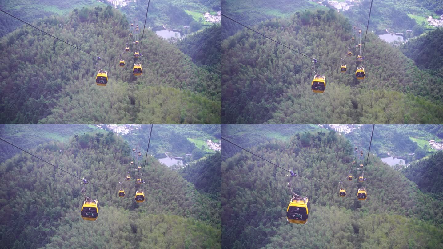 乘坐缆车景区索道观光缆车特写森林山上风景