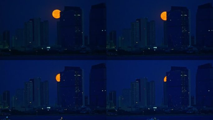 城市楼群中的月亮 城市上空的月亮 月圆