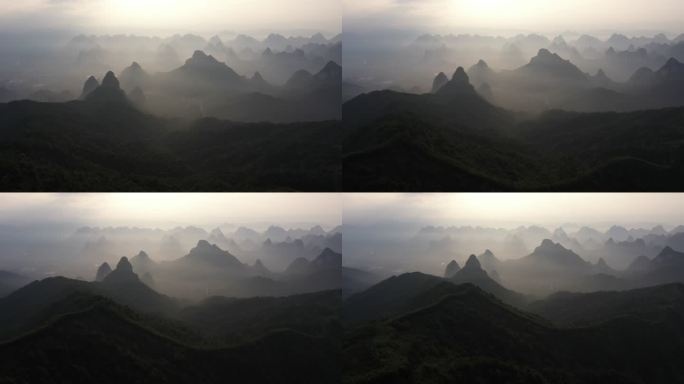航拍日出时分桂林的山和山谷中的雾