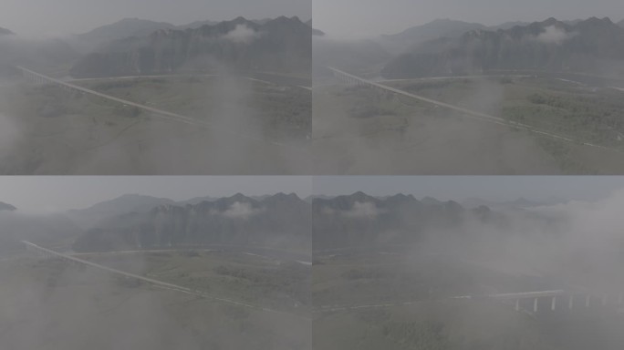 云雾下高铁驶过高铁桥
