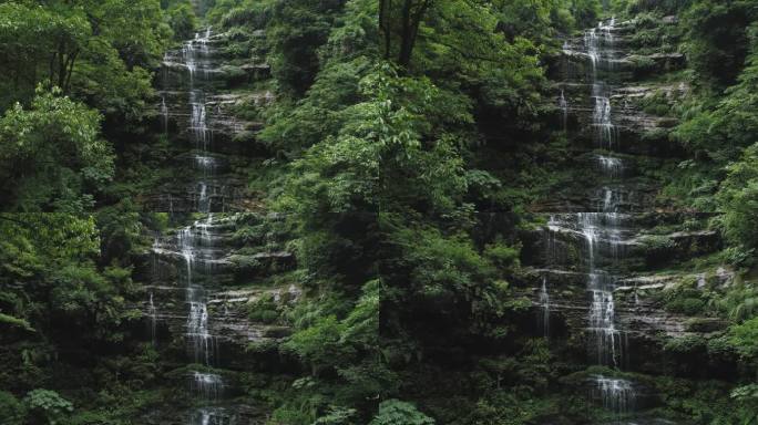 航拍山间岩石溪流瀑布清泉水