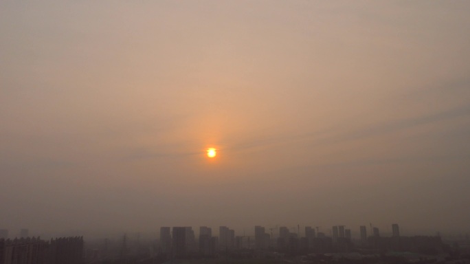 日出城市雾霾空气污染大雾黄色预警大气污染