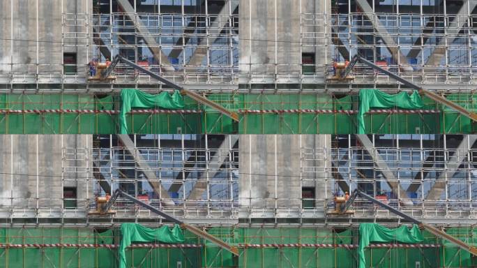 高楼上脚手架施工的工人