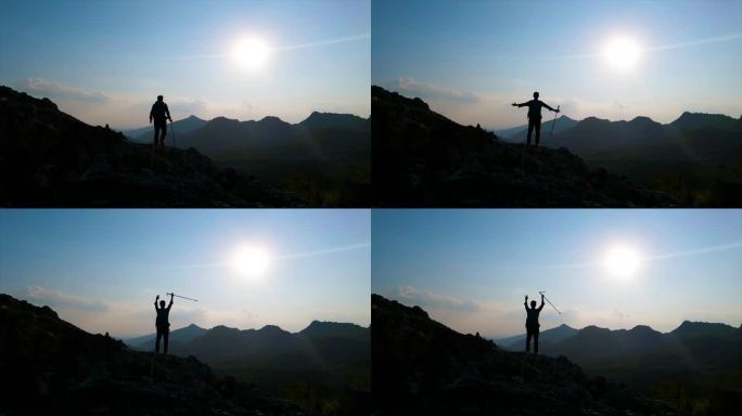 登山者站在山顶举手呐喊向往自由山顶呐喊