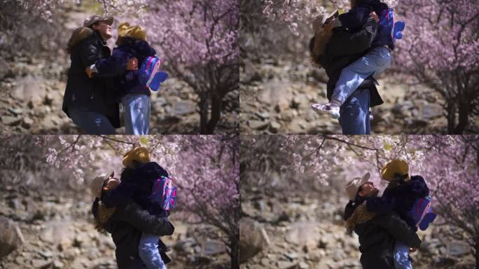 心情愉悦 甜甜的 妈妈抱着孩子看花桃花节