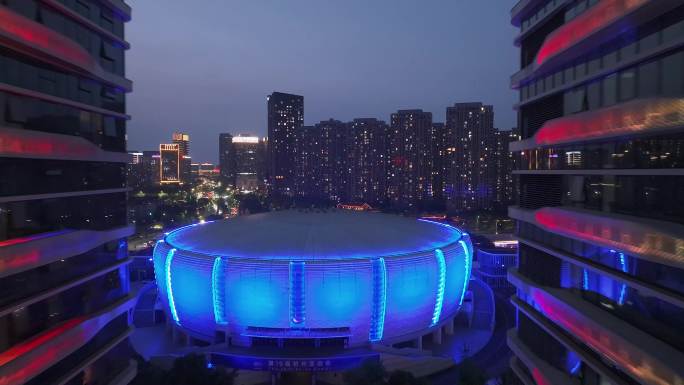 滨江体育馆素材 夜景穿楼前推