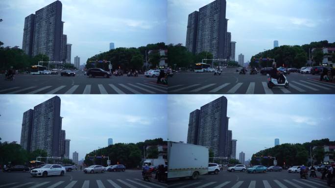红绿灯下过斑马线的人流转弯的车辆行人马路