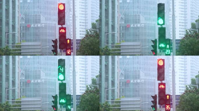红绿灯雨中红绿灯城市交通信号灯十字路口车
