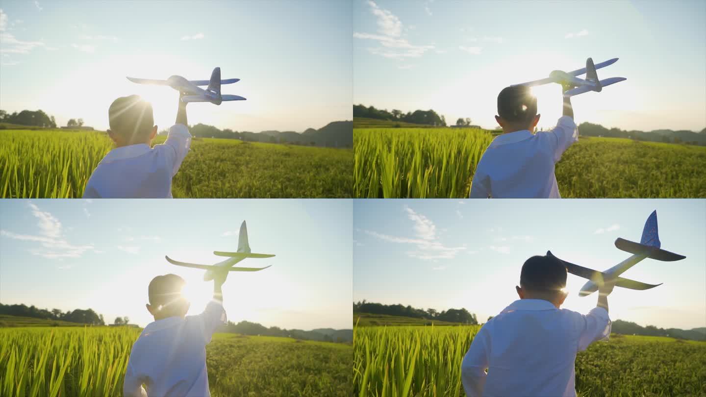 小男孩男装飞机模型逆光奔跑欢乐童年儿童节