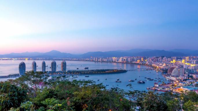 海南岛三亚CBD凤凰岛夜景晚霞延时日转夜