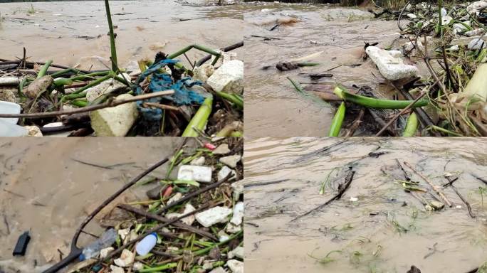 暴雨过后河面浑浊黄泥水水上洪水垃圾成堆