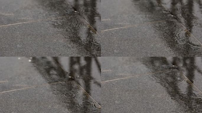 下雨的雨水打在地面时溅起的水花慢动作