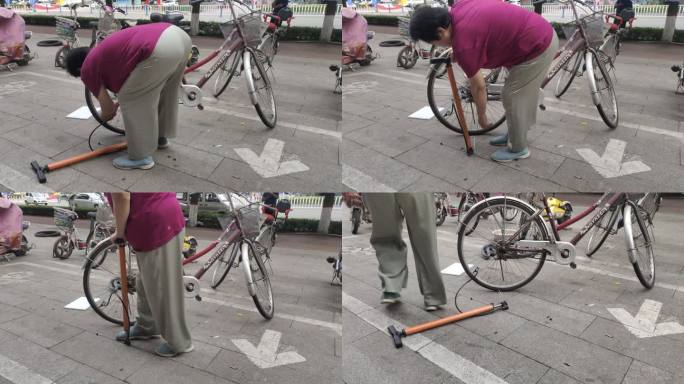 自行车打气 打气筒 中年妇女 自行车
