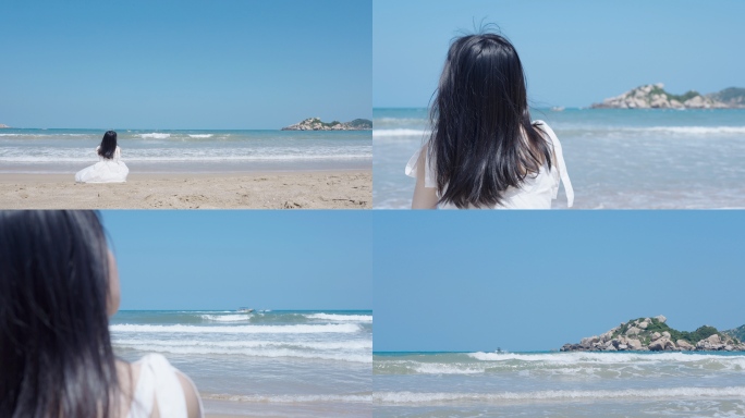 美女坐在海边看海发呆
