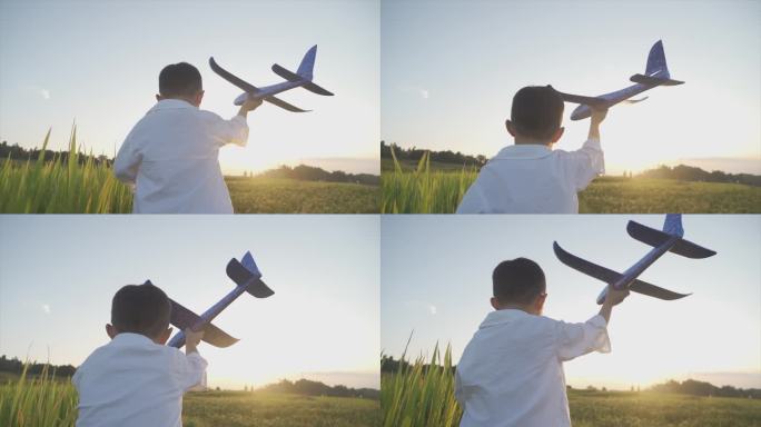 欢乐小男孩拿着飞机模型欢快奔跑幸福时光