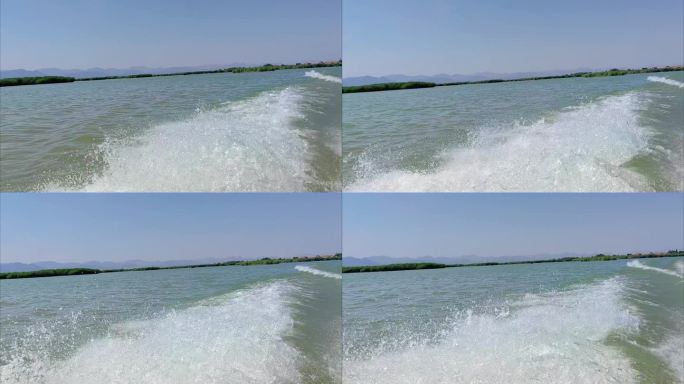 宁夏石嘴山沙湖旅游区快艇掀起的波浪