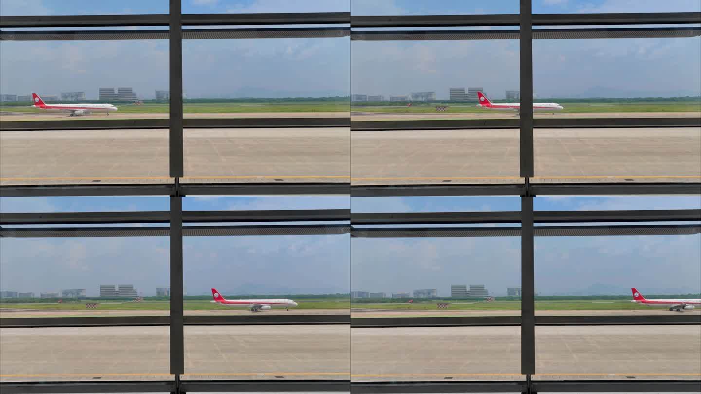 厦门高崎国际机场航站楼外滑行的飞机航班