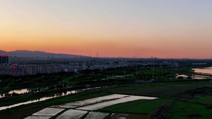 航拍夕阳下的宁夏石嘴山市惠农区城市风光