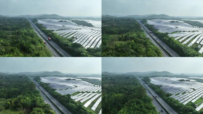 航拍高速公路穿过森林和太阳能光伏发电站