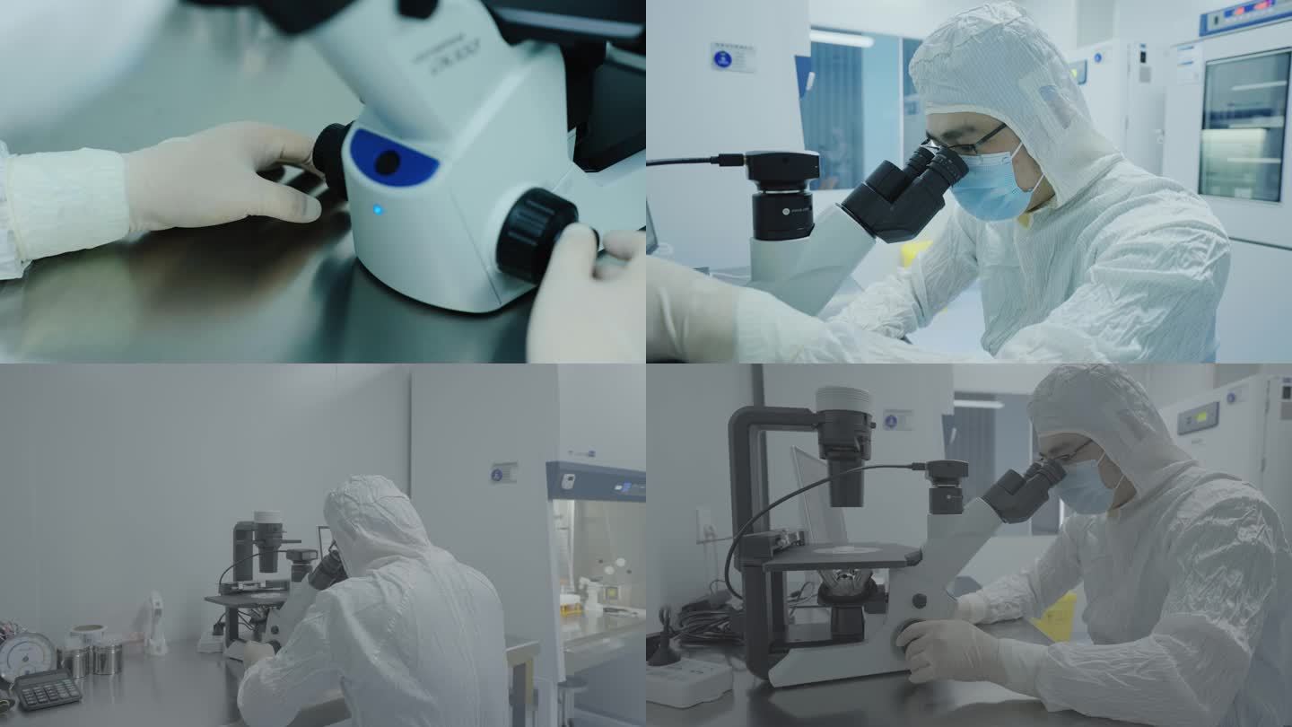 实验人员使用显微镜观察样本