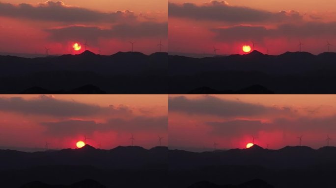 太行山下的日落夕阳下的风力发电