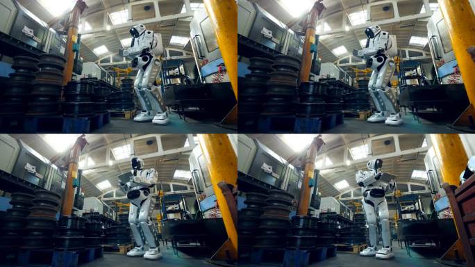 机器人在工厂检查金属件，使用平板电脑.
