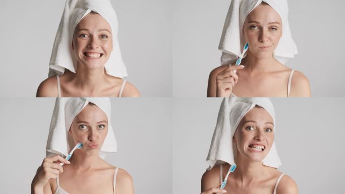 年轻迷人而有趣的女人，头上拿着毛巾，高高兴兴地摆出一副在灰色背景下清洁牙齿的样子。鬼鬼祟祟