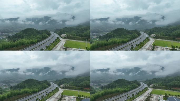 森林公路航拍雨后森林高速公路树林云雾风景