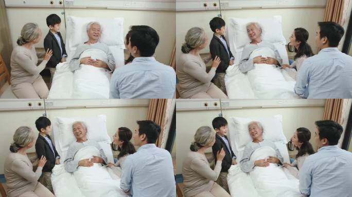 亚洲家庭和一个孩子的母亲、父亲、祖母到医院病房看望祖父