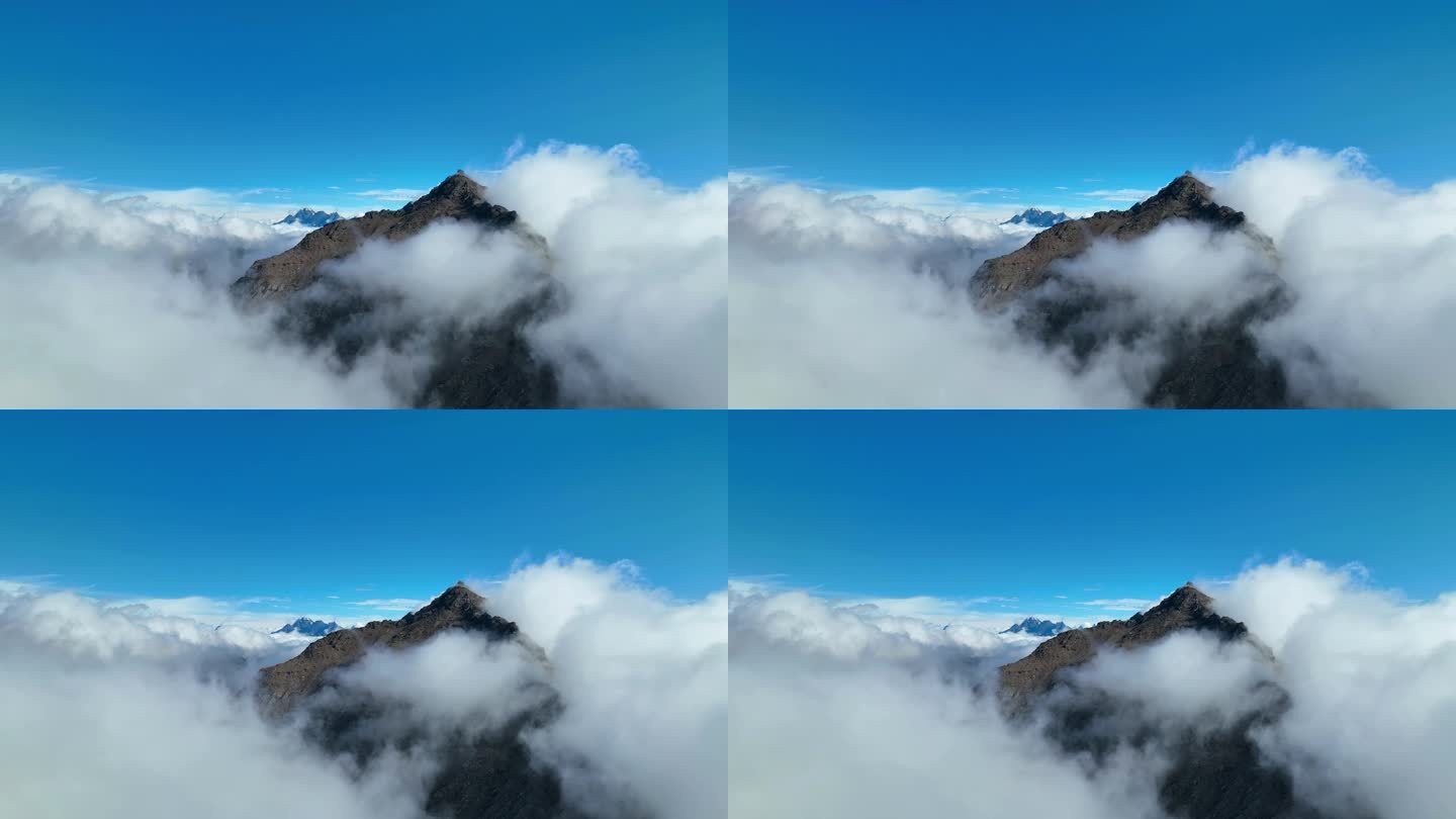 航拍云雾中的四川阿坝巴朗山垭口雪山群峰