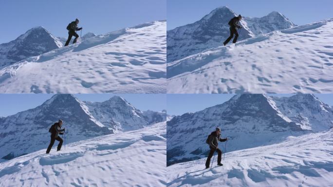 在山顶进行空中飞行。徒步旅行攀登瑞士阿尔卑斯山，冒险概念。