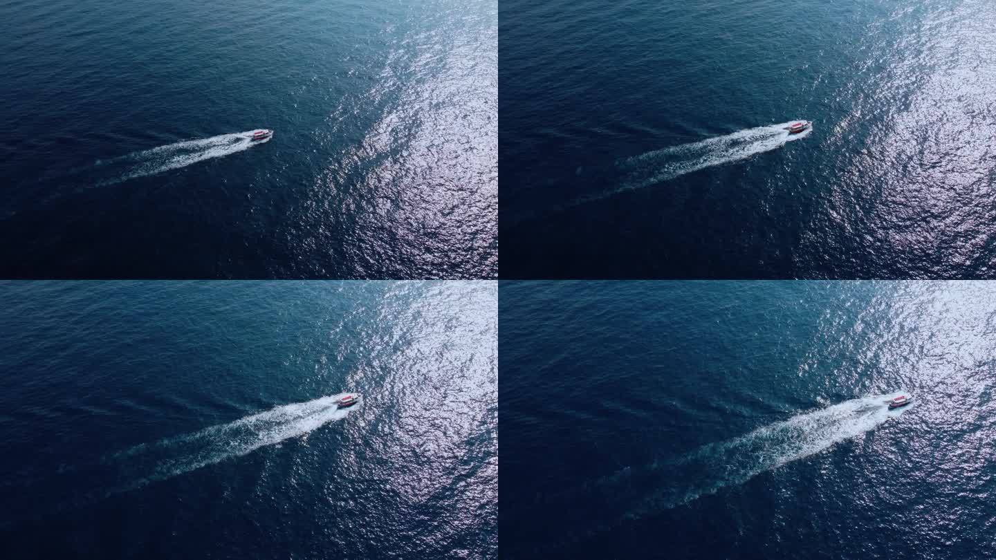 鸟瞰图的快速快艇在圆圈中行驶，并在清澈的绿松石神奇的海洋中形成美丽的形状。顶级旅游目的地。