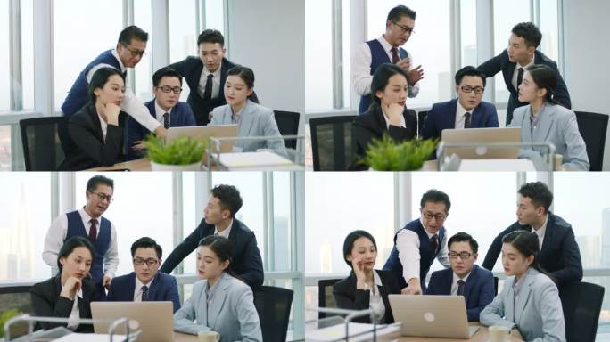 由五位亚洲公司高管组成的小组在办公室开会，讨论在现代公司使用笔记本电脑开展业务的问题