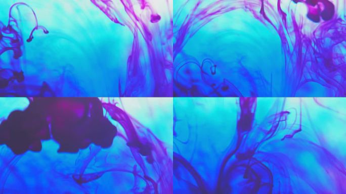 蓝色和红色颜料油墨滴在水中的慢动作视频与复制空间。墨水云在水下旋转.