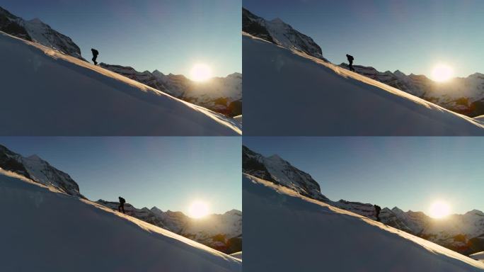 在山顶进行空中飞行。徒步攀登瑞士阿尔卑斯山的剪影，冒险概念。