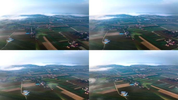 西北平原乡间田野清晨日出平流雾航拍延时