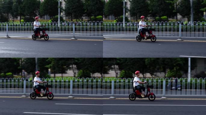 城市道路骑共享电单车飞驰的男孩