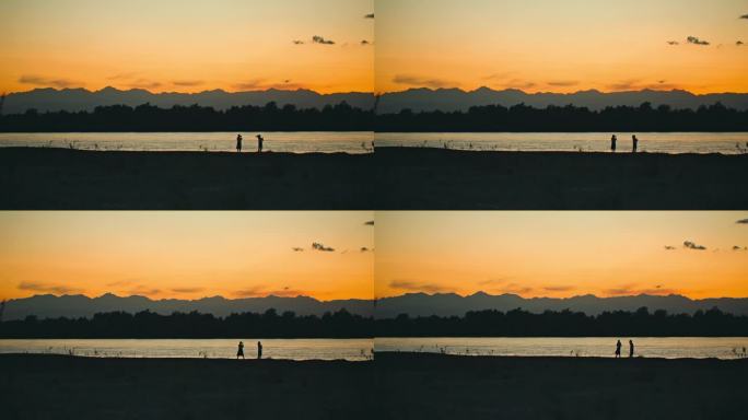 夕阳落日黄河岸边拍照的人