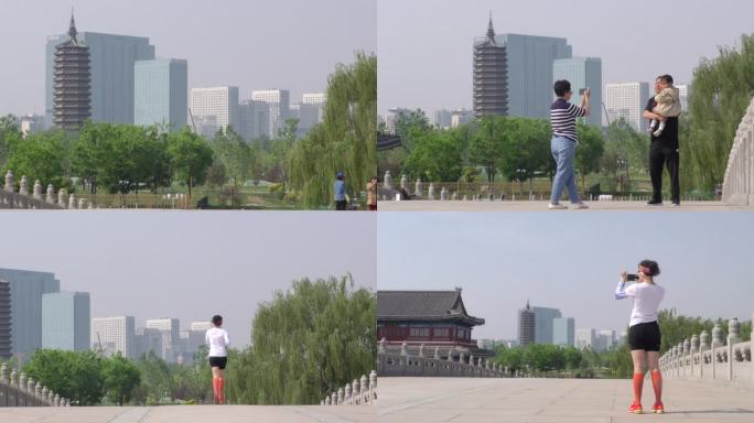 北京通州燃灯塔游客拍照游览美女跑步晨跑